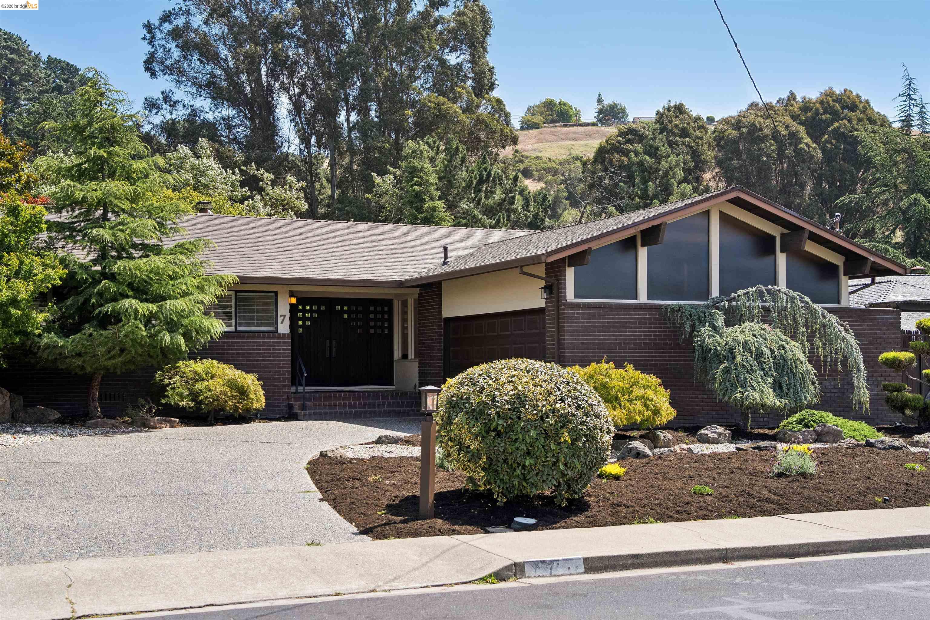7 Jo Lin Court El Sobrante, CA 94803 - Photo 14 of 99 Mid-century modern exterior featuring a low-pitched roofline and brick facade