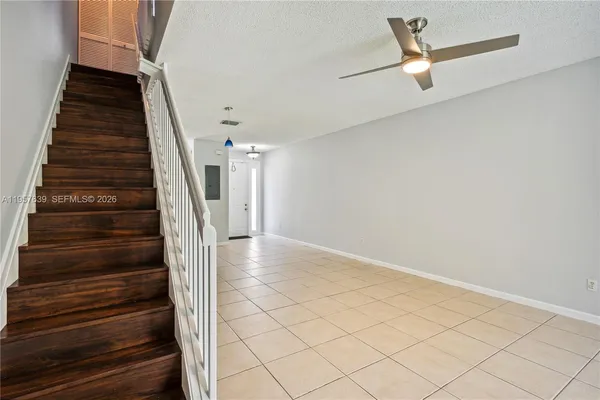 a view of staircase with wooden floor