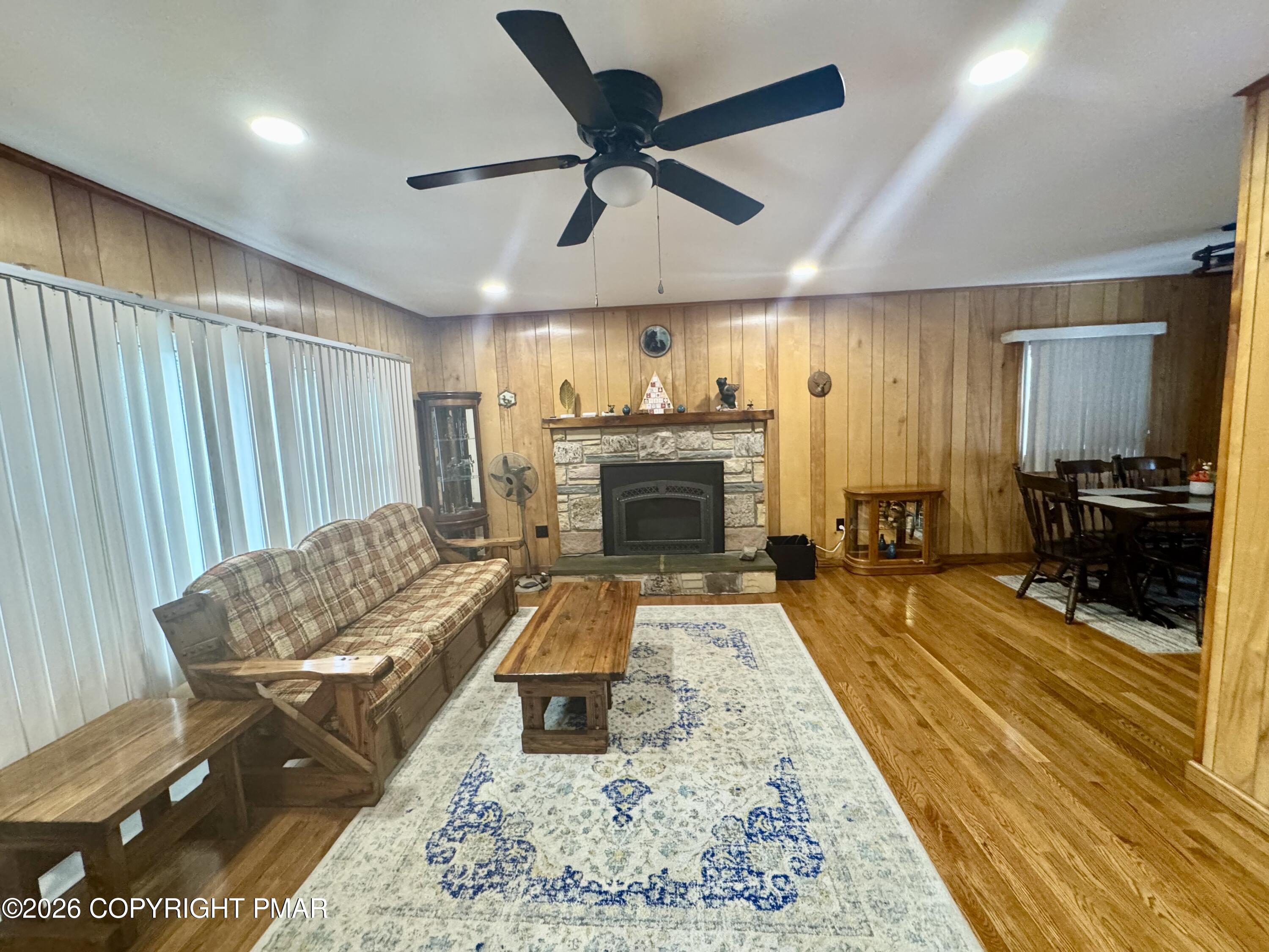 2317 Locust Ridge Road Pocono Lake, PA 18347 - Photo 13 of 49 a living room with furniture and a fireplace
