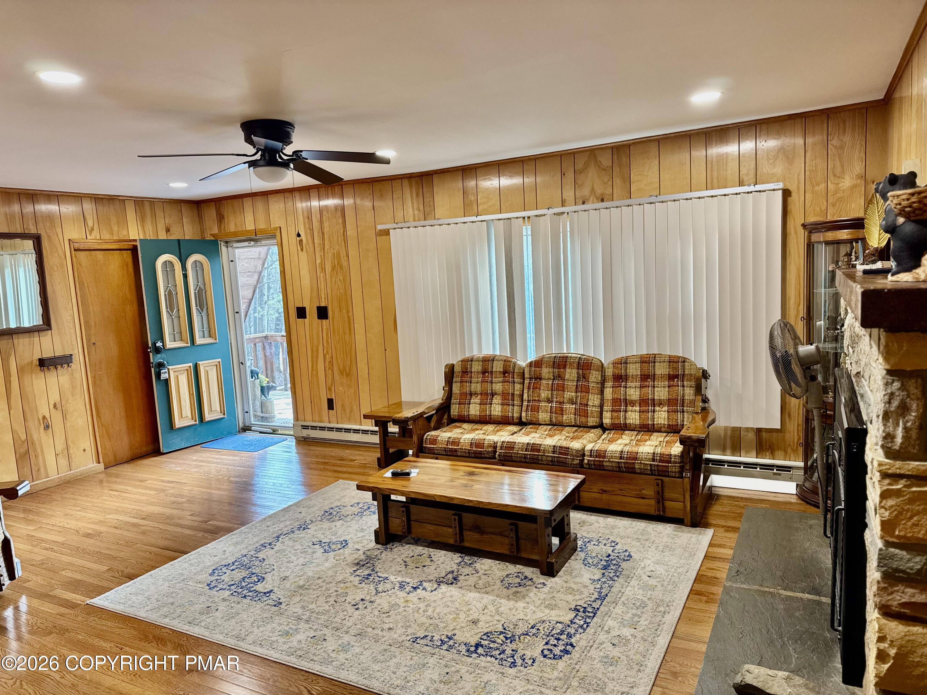 2317 Locust Ridge Road Pocono Lake, PA 18347 - Photo 14 of 49 a living room with furniture and a rug