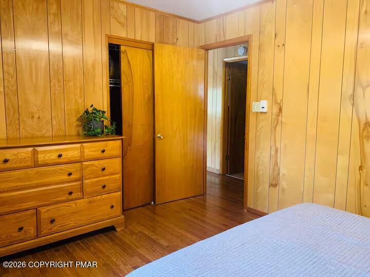 2317 Locust Ridge Road Pocono Lake, PA 18347 - Photo 25 of 49 a view of a bedroom with wooden floor and cabinet