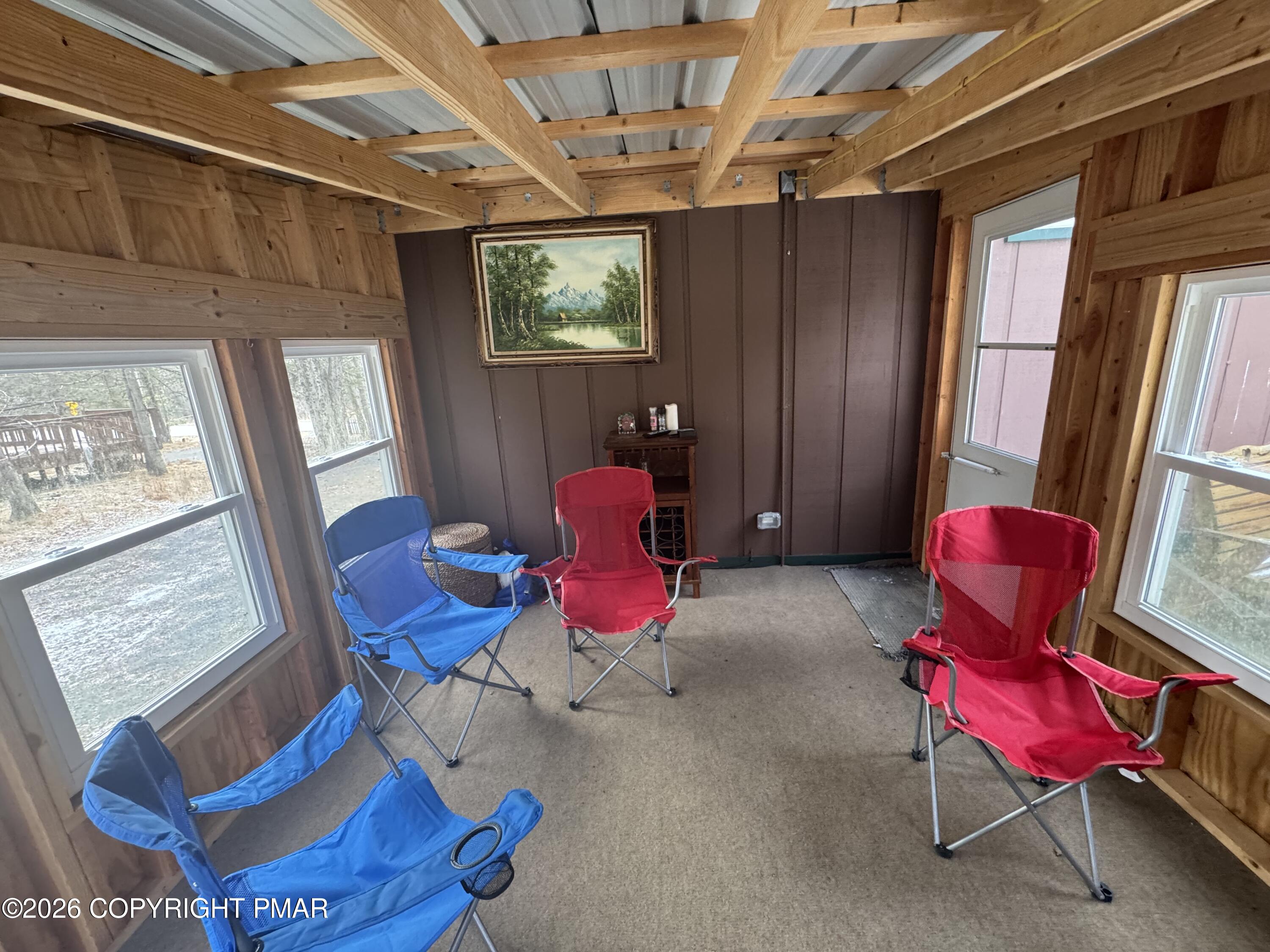 2317 Locust Ridge Road Pocono Lake, PA 18347 - Photo 34 of 49 a living room with furniture and windows