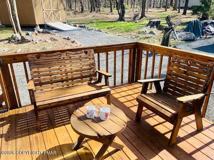2317 Locust Ridge Road Pocono Lake, PA 18347 - Photo 39 of 49 a view of a chairs and table on the deck