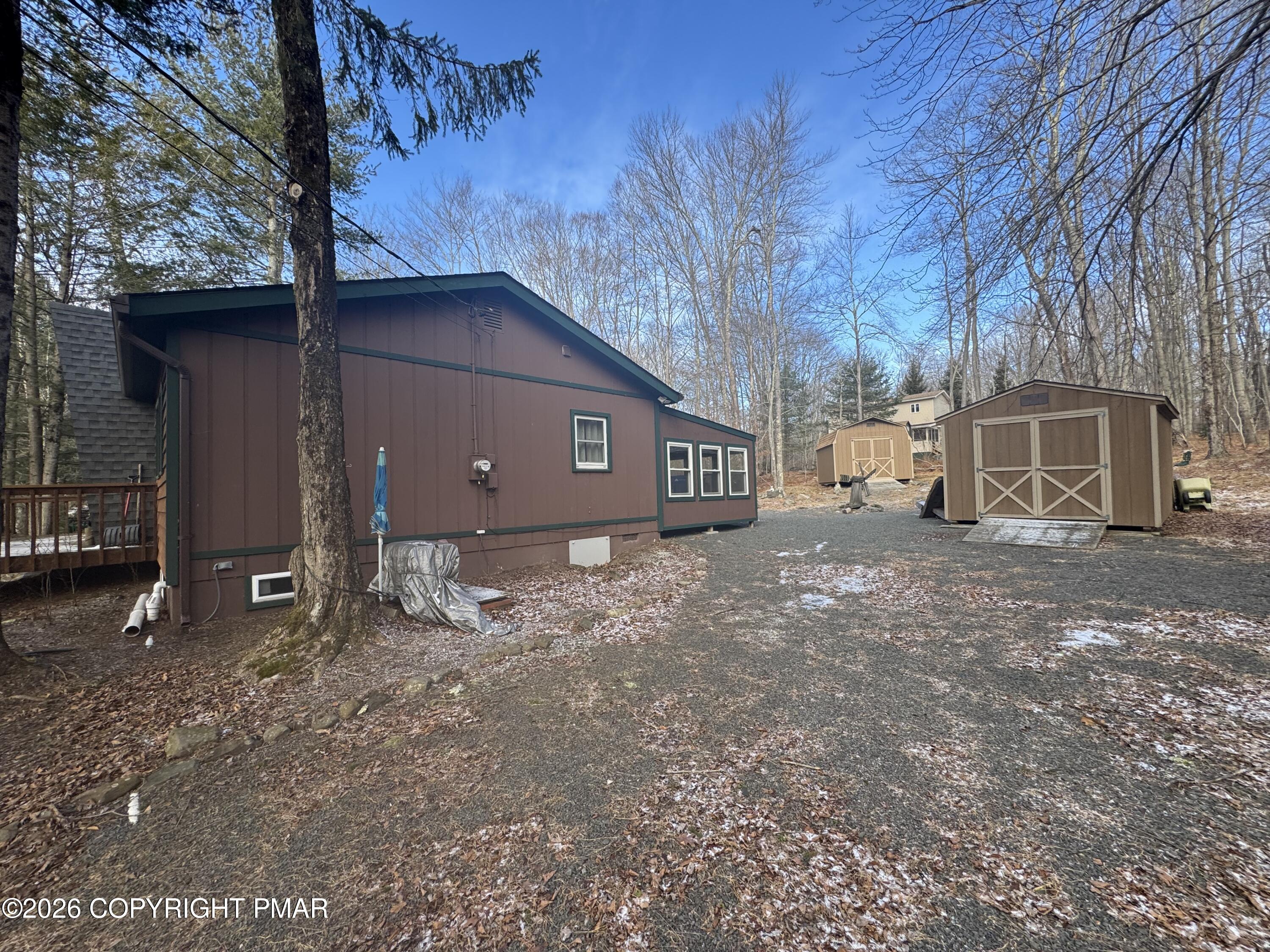 2317 Locust Ridge Road Pocono Lake, PA 18347 - Photo 42 of 49 a view of a house with a yard