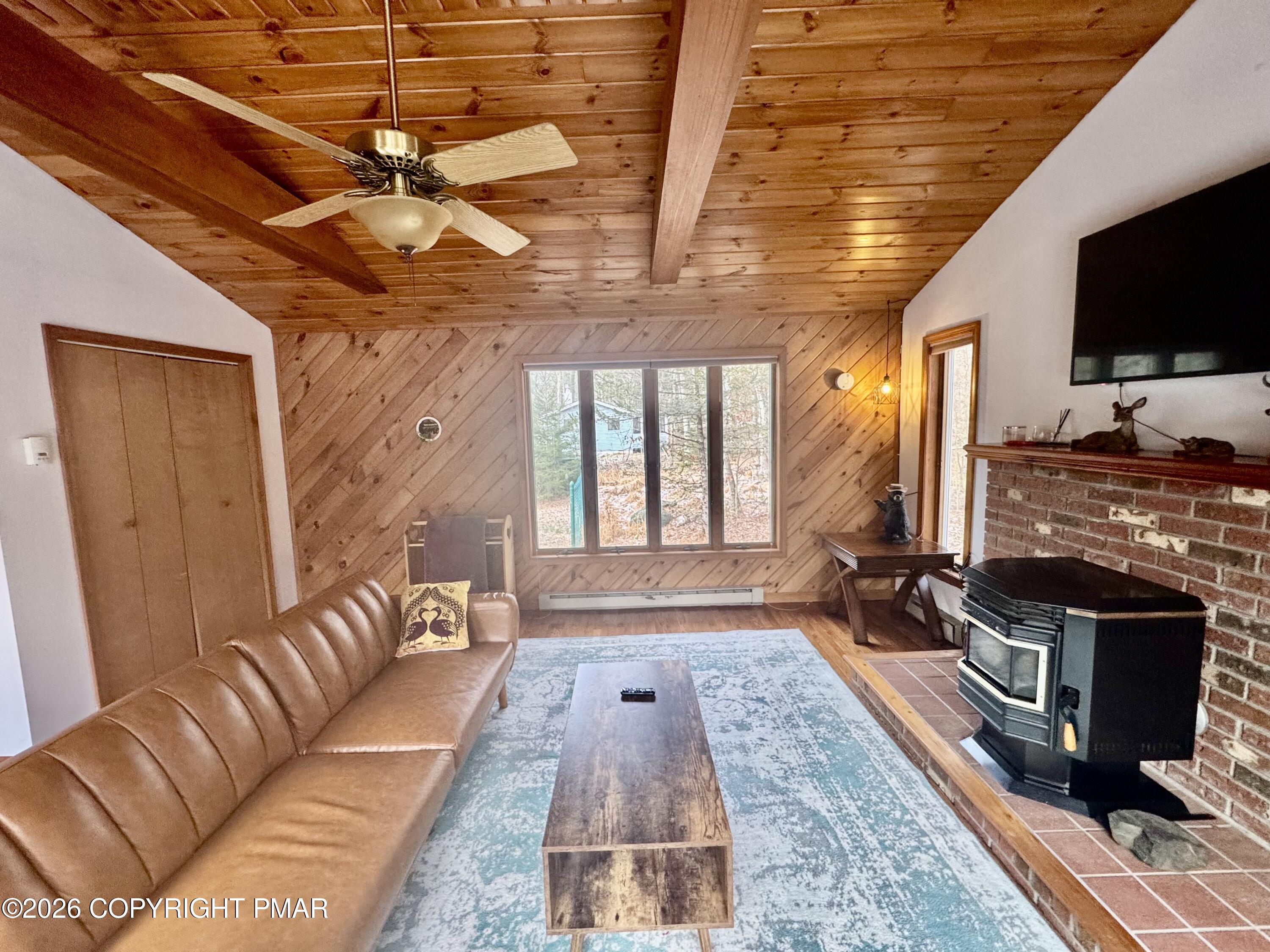 2317 Locust Ridge Road Pocono Lake, PA 18347 - Photo 6 of 49 a living room with furniture and flat screen tv