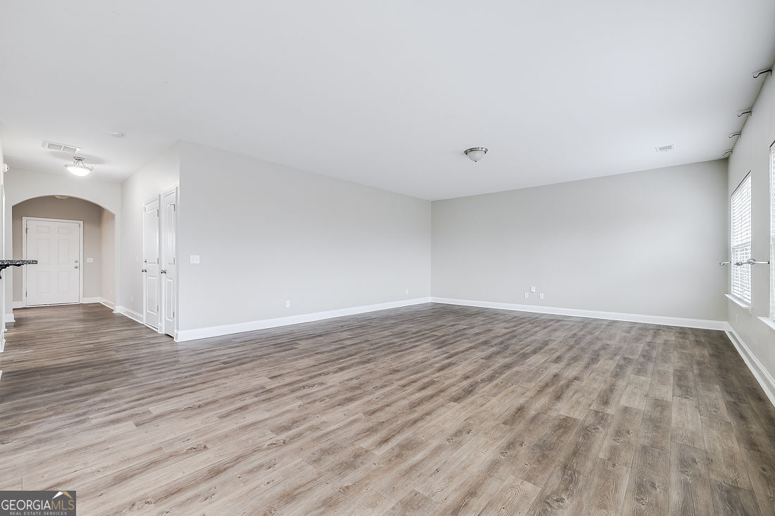 4 Bridlington Way Savannah, GA 31407 - Photo 11 of 38 a view of an empty room with wooden floor and a window