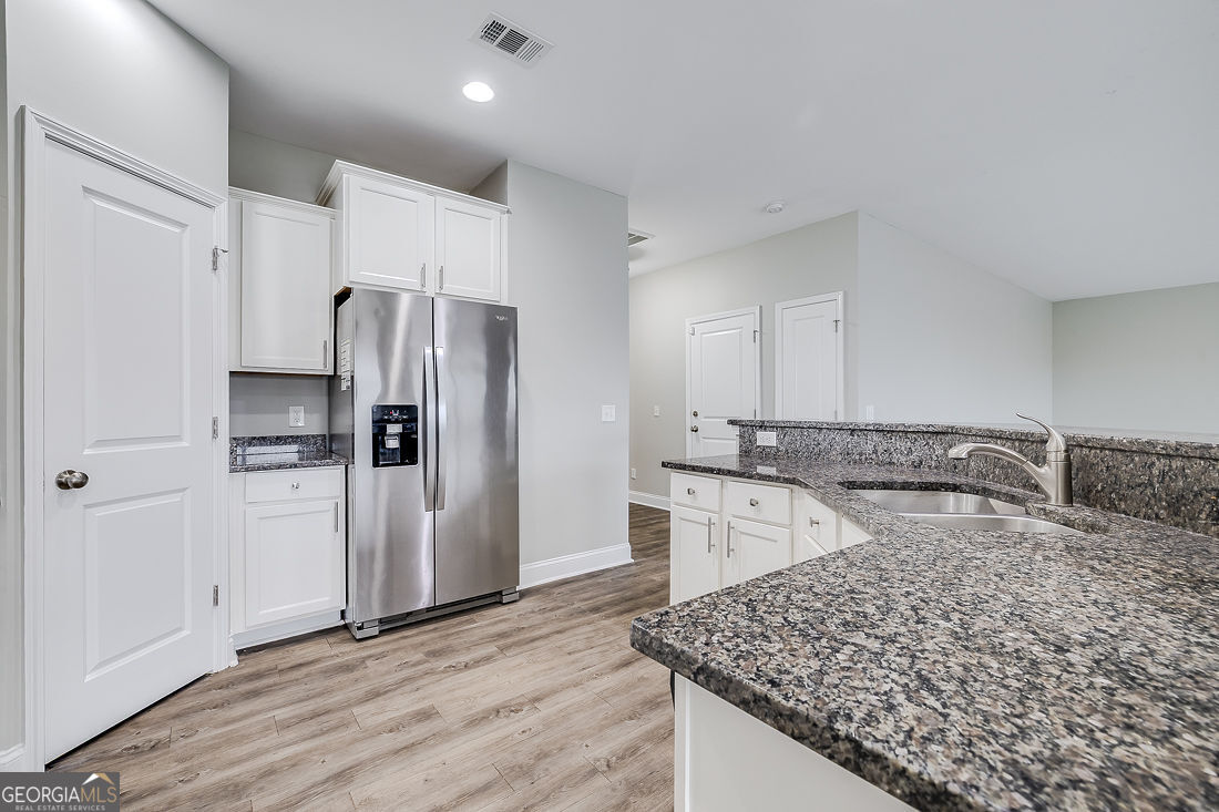 4 Bridlington Way Savannah, GA 31407 - Photo 15 of 38 a kitchen with a refrigerator and a sink