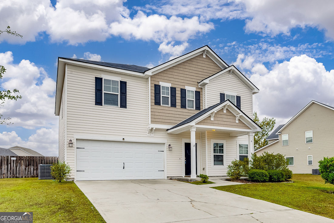 4 Bridlington Way Savannah, GA 31407 - Photo 2 of 38 a front view of a house with garden