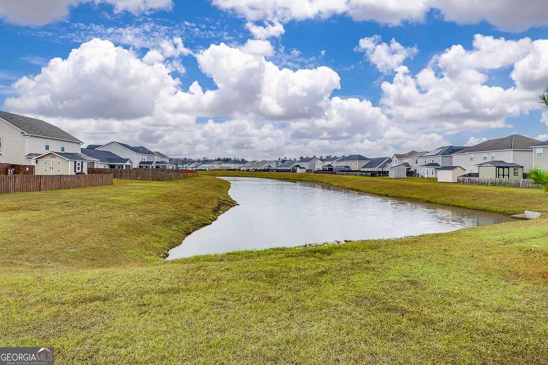 4 Bridlington Way Savannah, GA 31407 - Photo 36 of 38 a view of a lake with houses in the back