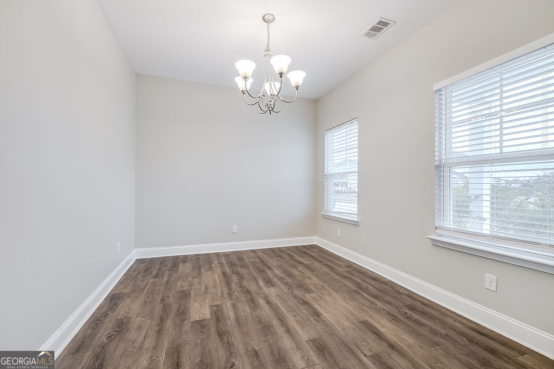 4 Bridlington Way Savannah, GA 31407 - Photo 5 of 38 a view of a room with wooden floor and a window