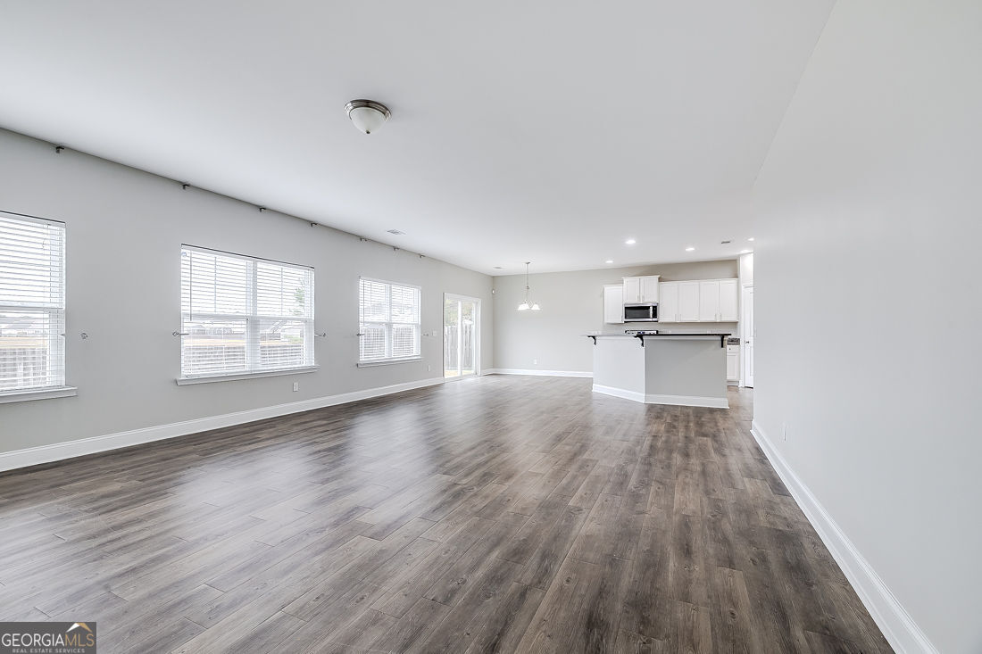 4 Bridlington Way Savannah, GA 31407 - Photo 9 of 38 a view of empty room with wooden floor and window