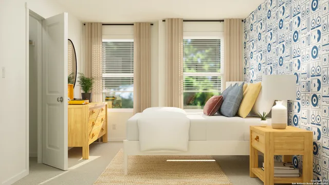 a bedroom with a bed and a couch