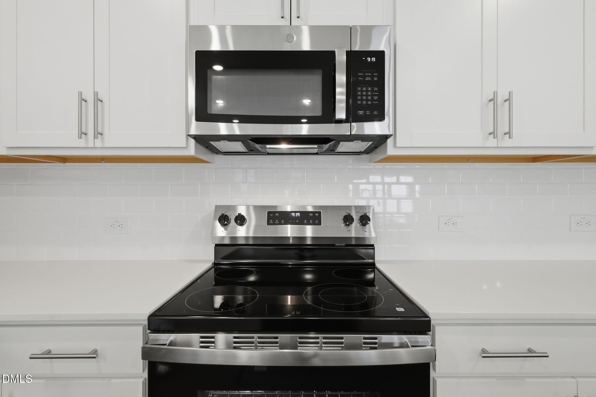 155 Digging Time Avenue Princeton, NC 27569 - Photo 12 of 29 a stove top oven sitting inside of a kitchen
