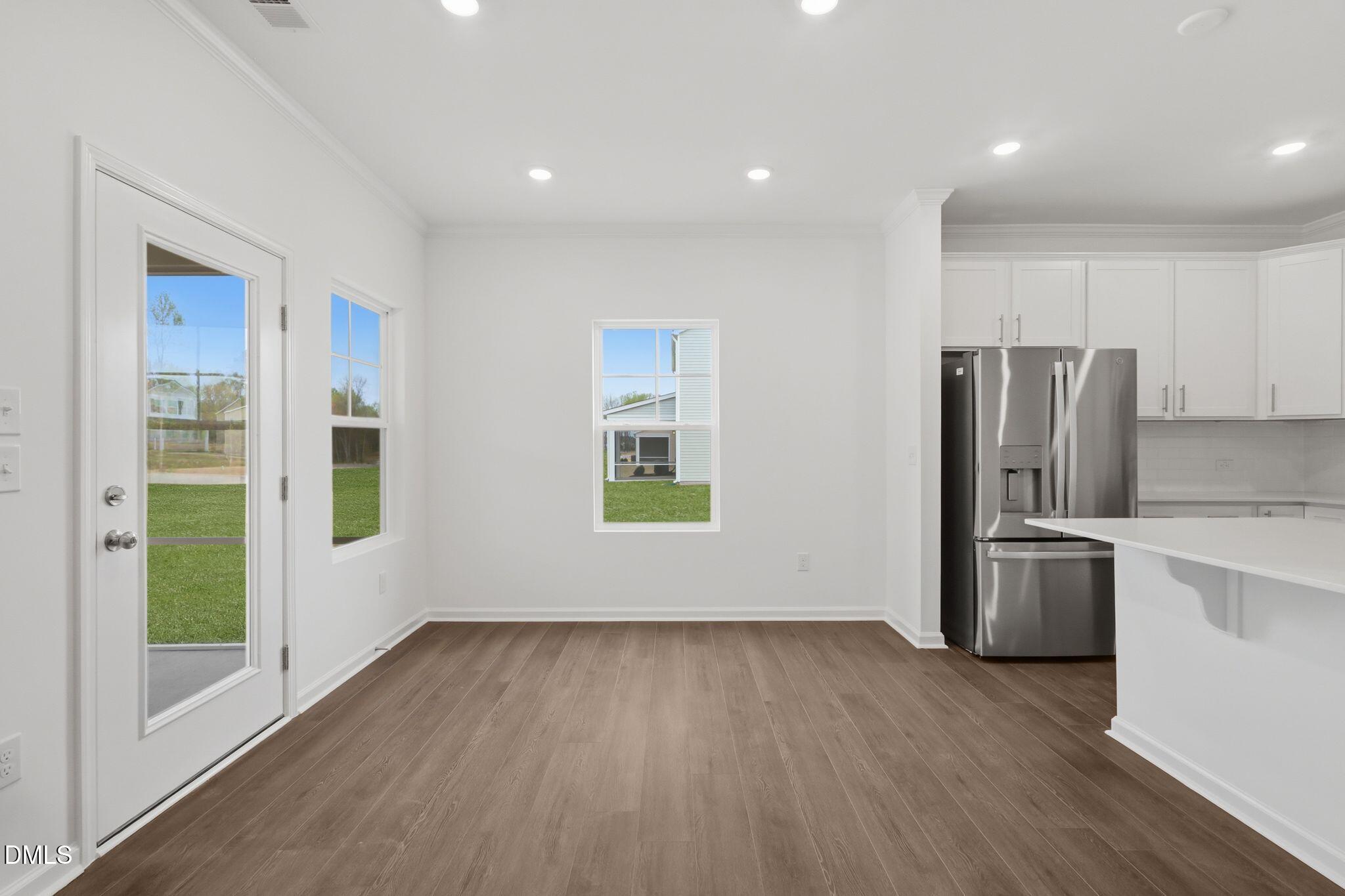 155 Digging Time Avenue Princeton, NC 27569 - Photo 14 of 29 a view of kitchen with a sink refrigerator and wooden floor