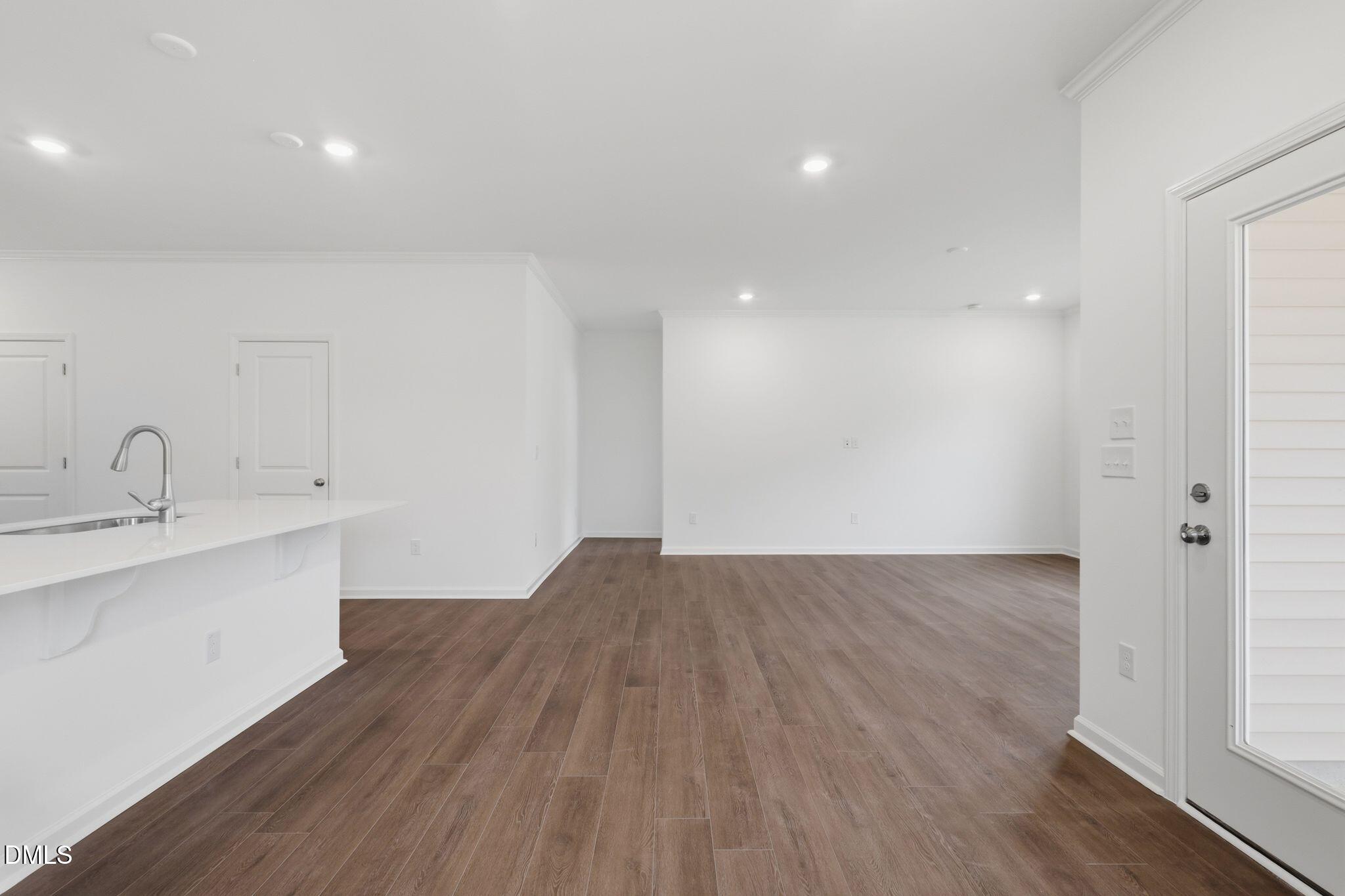 155 Digging Time Avenue Princeton, NC 27569 - Photo 16 of 29 a view of a kitchen with sink and wooden floor