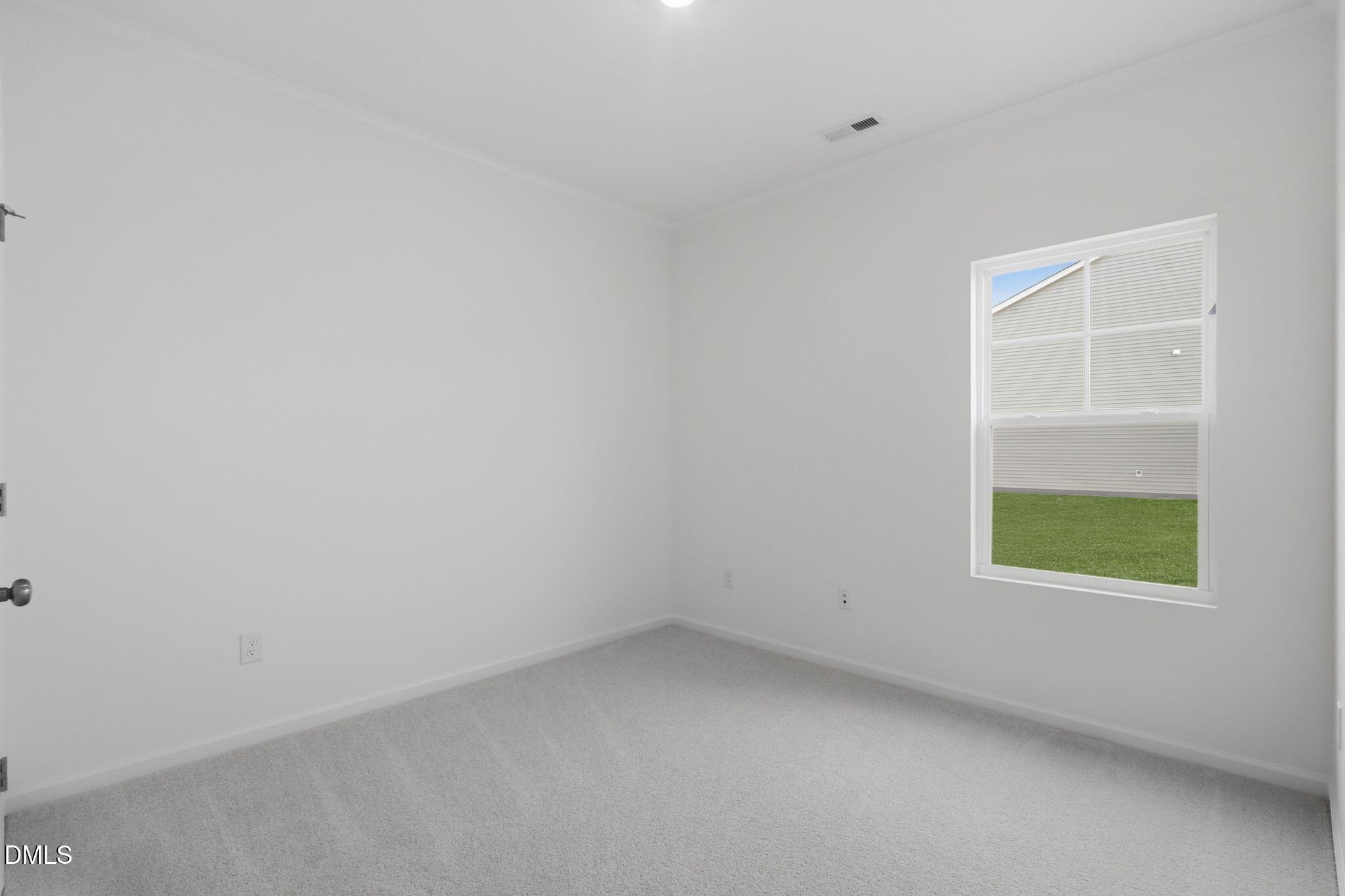 155 Digging Time Avenue Princeton, NC 27569 - Photo 19 of 29 an empty room with a window