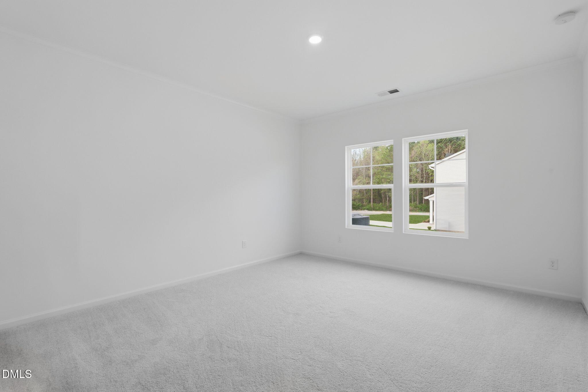 155 Digging Time Avenue Princeton, NC 27569 - Photo 23 of 29 an empty room with a window