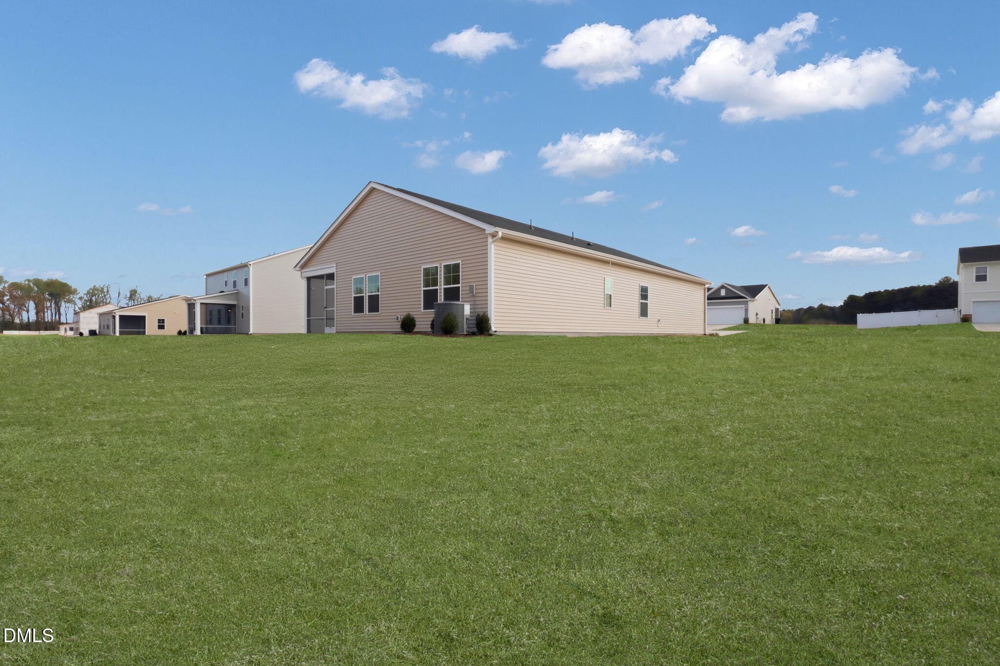 155 Digging Time Avenue Princeton, NC 27569 - Photo 27 of 29 a house view with a garden space