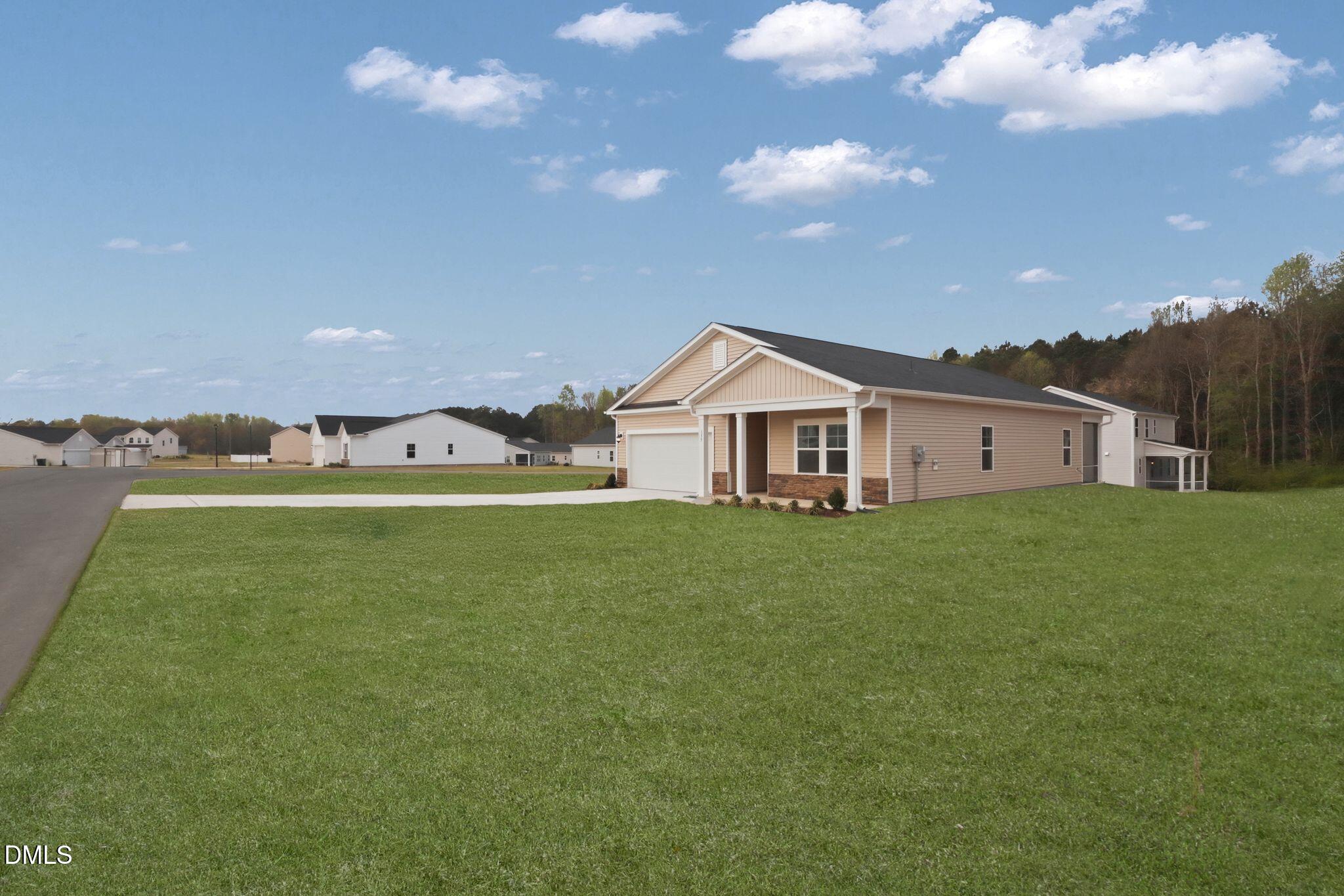 155 Digging Time Avenue Princeton, NC 27569 - Photo 3 of 29 a view of a house with a big yard
