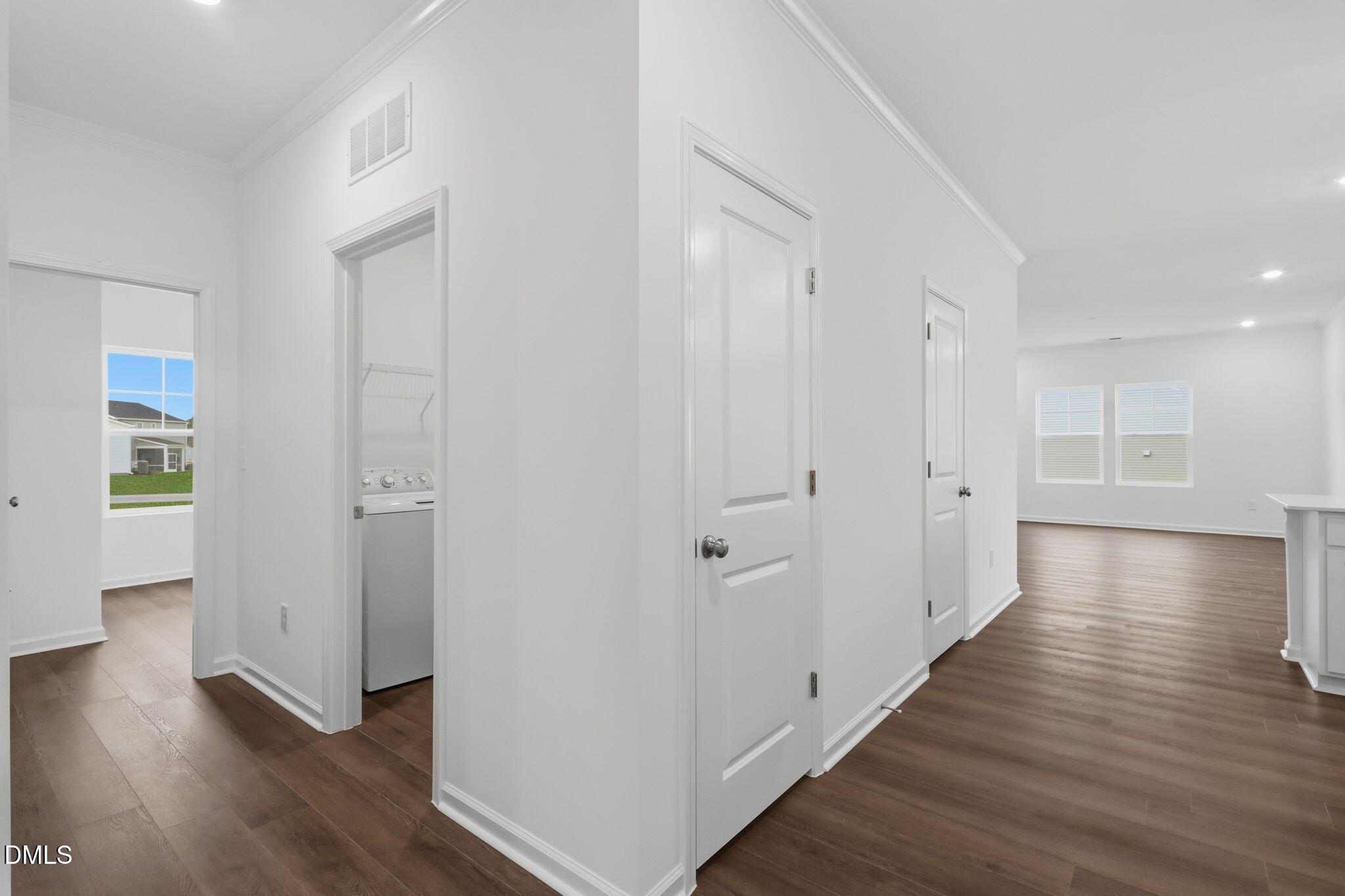 155 Digging Time Avenue Princeton, NC 27569 - Photo 6 of 29 a view of a hallway with wooden floor
