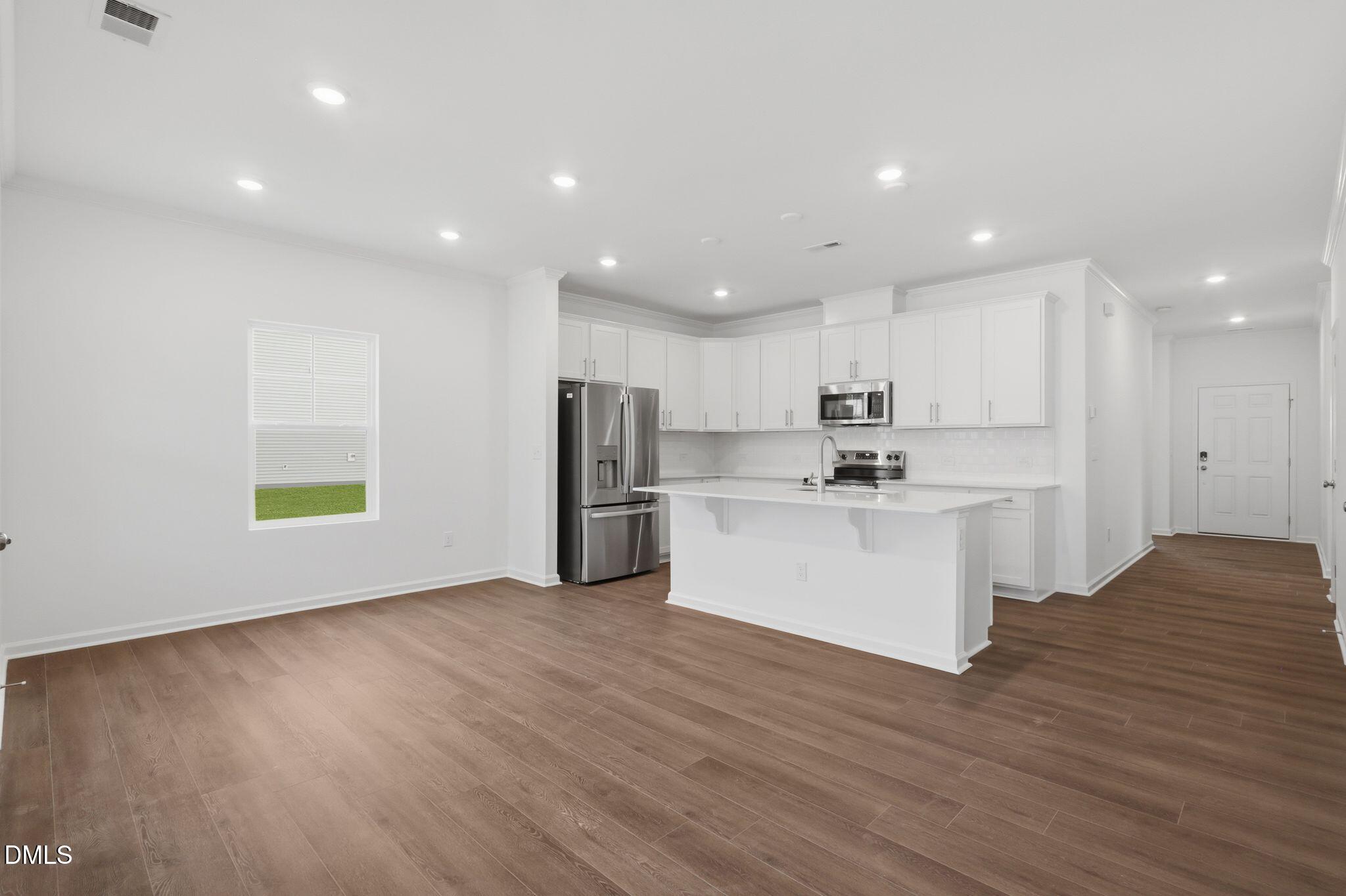 155 Digging Time Avenue Princeton, NC 27569 - Photo 7 of 29 a view of kitchen with wooden floor
