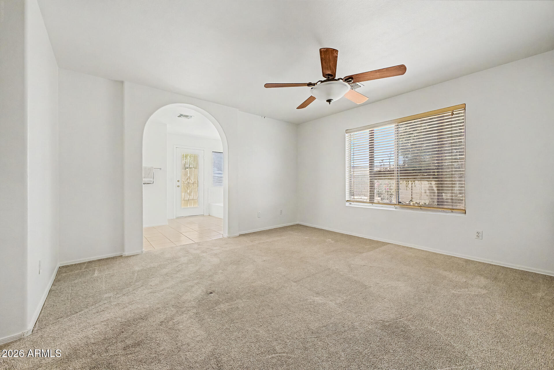 2762 North Ricardo Mesa, AZ 85215 - Photo 22 of 38 an empty room with windows and ceiling fan