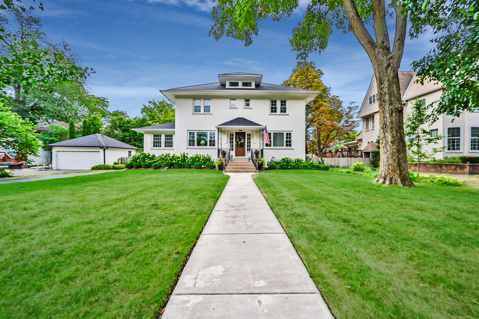 147 Herrick Road Riverside, IL 60546 - Photo 2 of 55 a front view of house with yard and green space