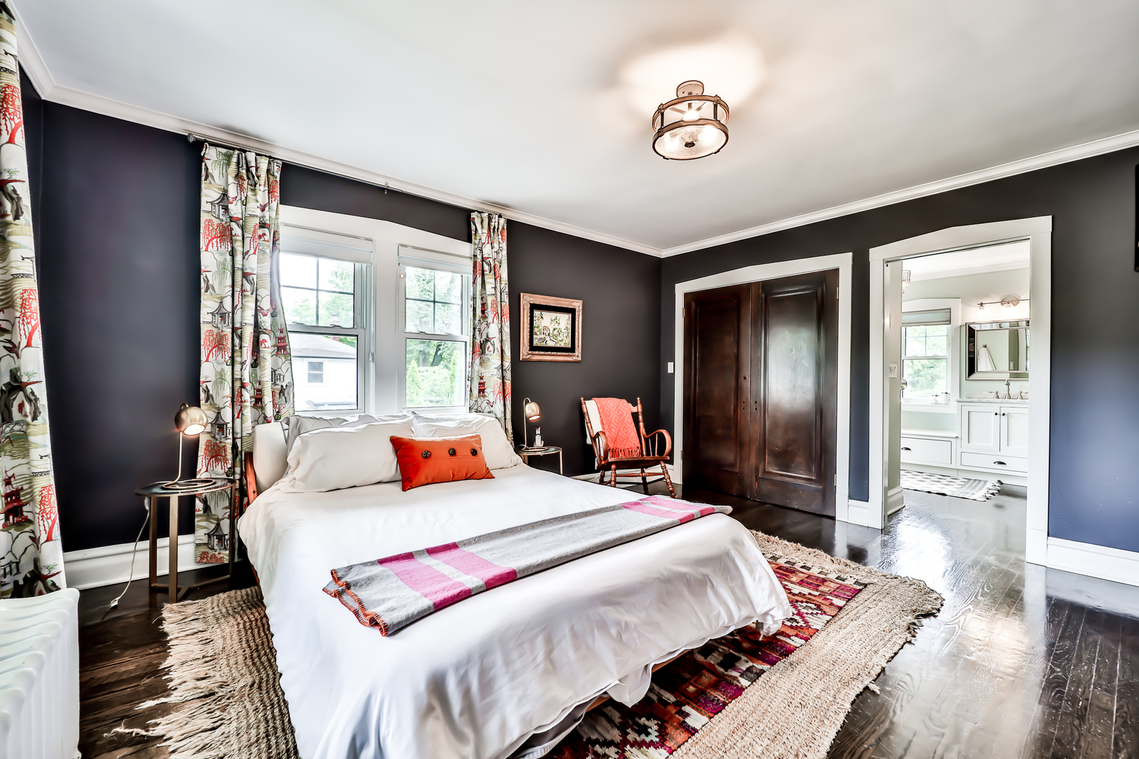 147 Herrick Road Riverside, IL 60546 - Photo 27 of 55 a bedroom with a large bed and a chandelier