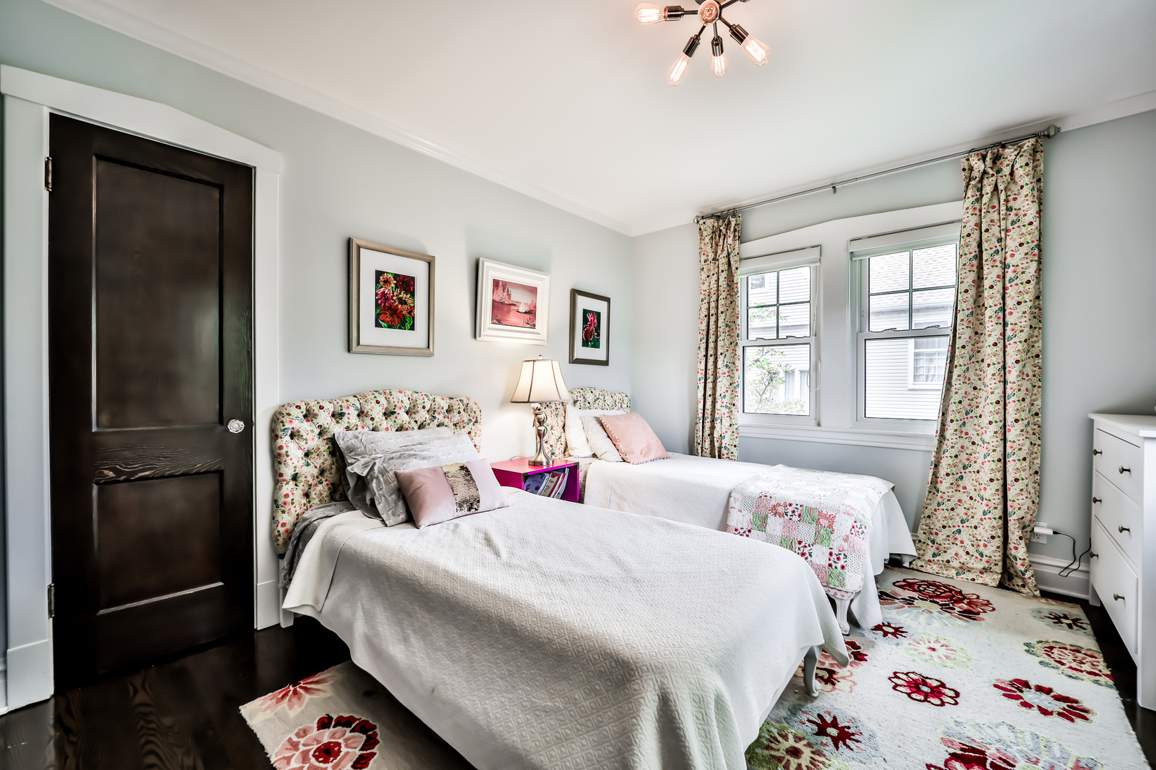 147 Herrick Road Riverside, IL 60546 - Photo 35 of 55 a bed room with a bed and a chandelier
