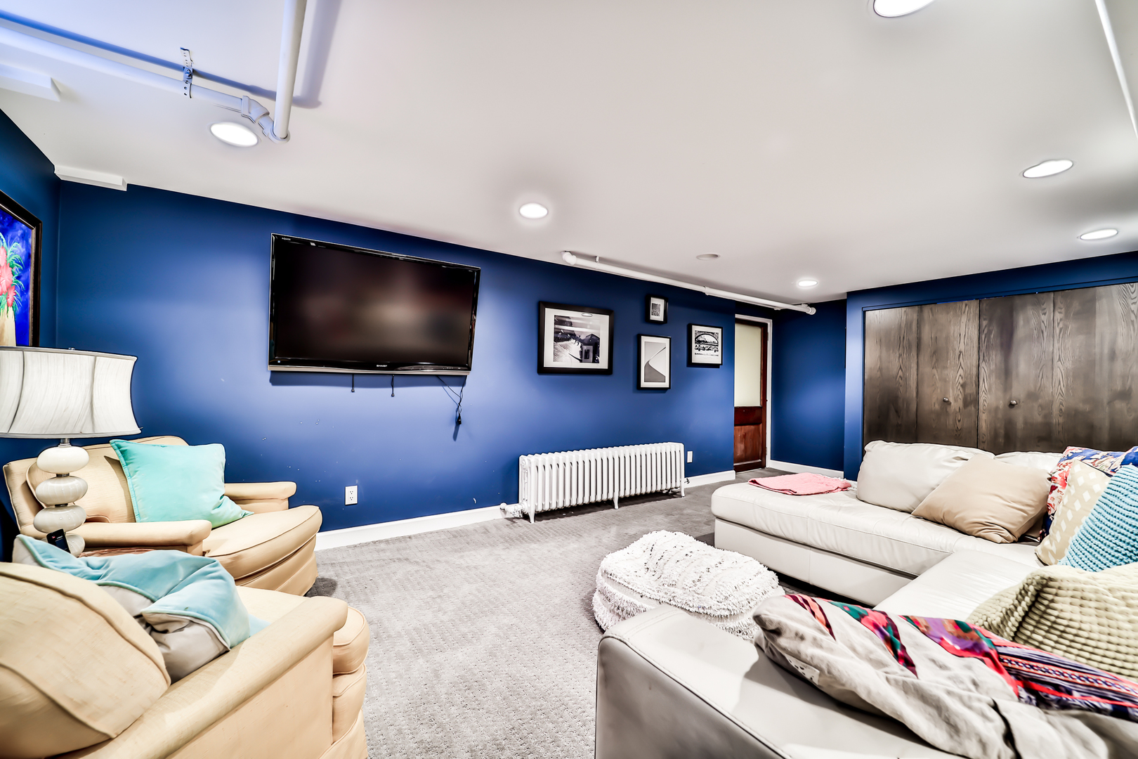 147 Herrick Road Riverside, IL 60546 - Photo 42 of 55 a living room with furniture and a flat screen tv