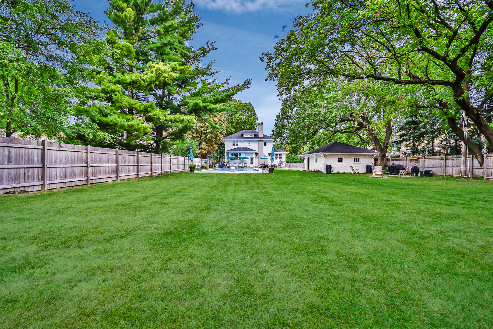 147 Herrick Road Riverside, IL 60546 - Photo 47 of 55 a view of a backyard with a small cabin
