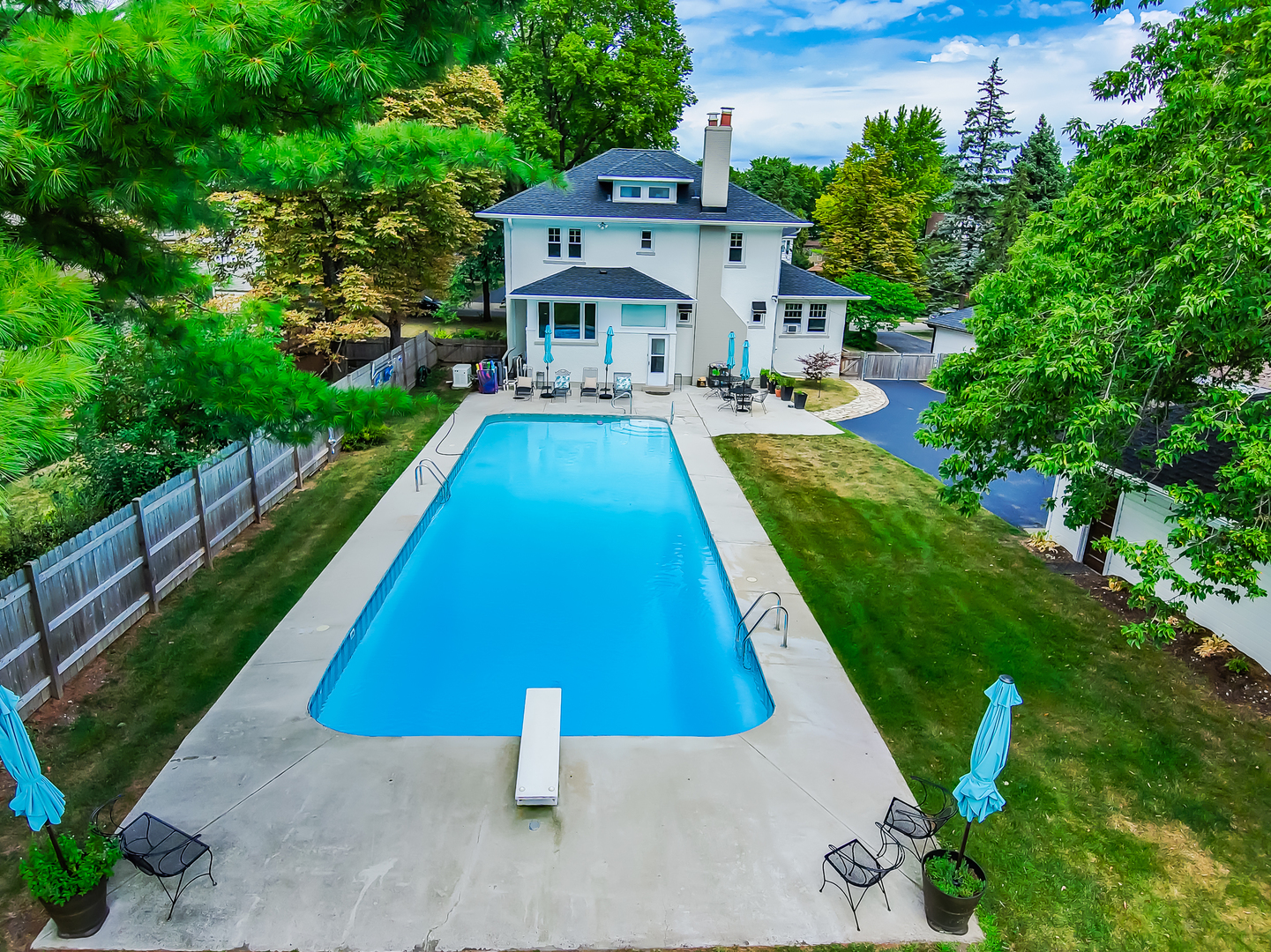 147 Herrick Road Riverside, IL 60546 - Photo 48 of 55 a front view of a house with swimming pool