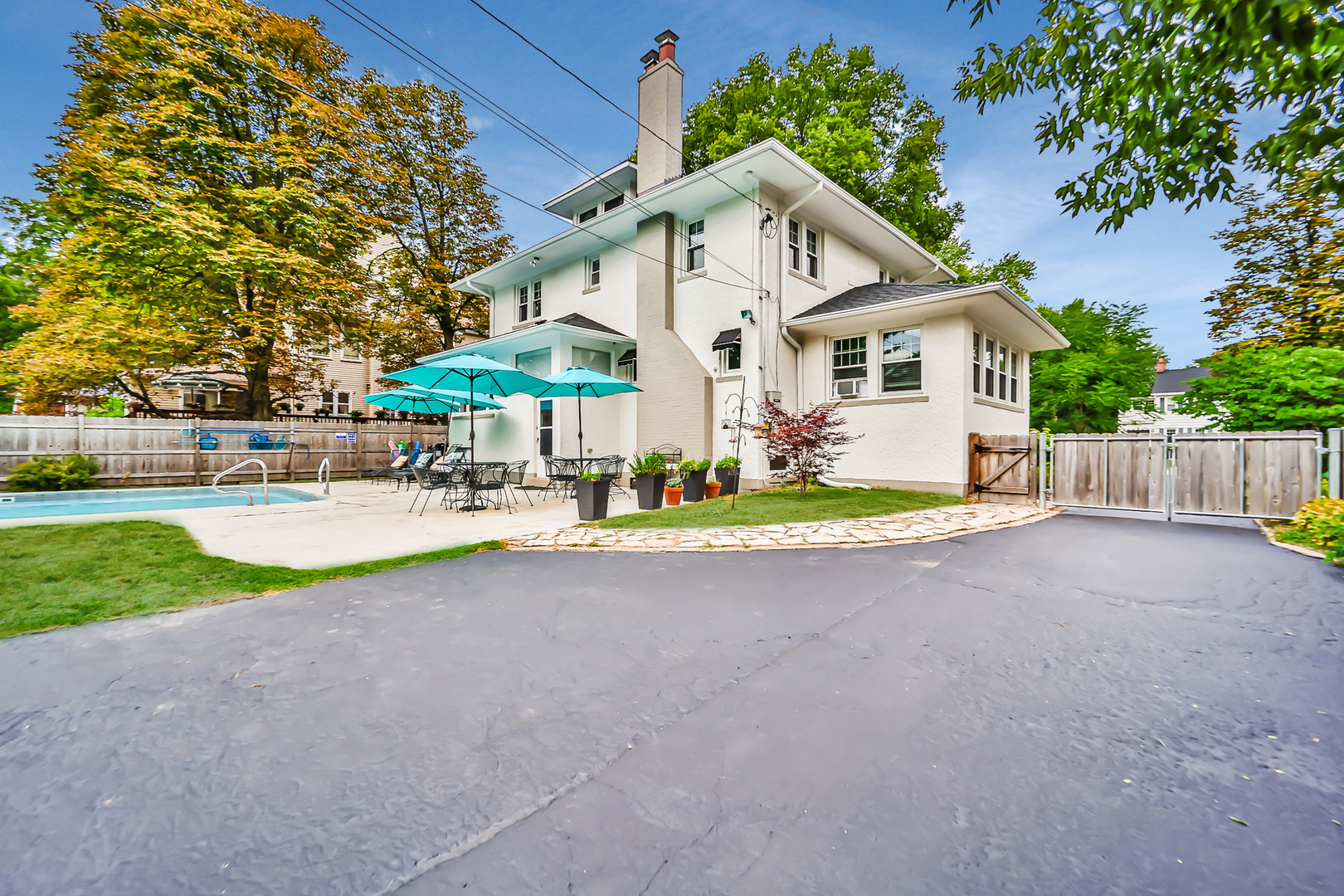 147 Herrick Road Riverside, IL 60546 - Photo 53 of 55 a view of a house with a big yard and large trees