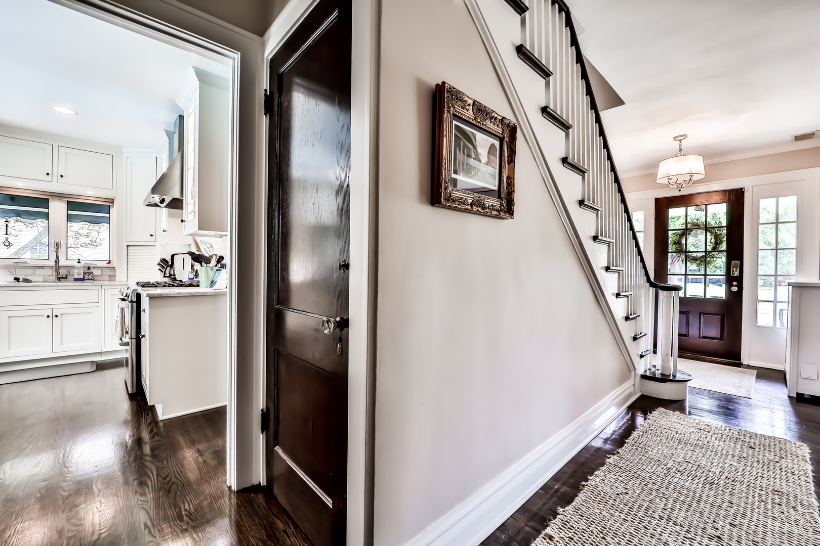 147 Herrick Road Riverside, IL 60546 - Photo 10 of 55 a view of a hallway with furniture and stairs