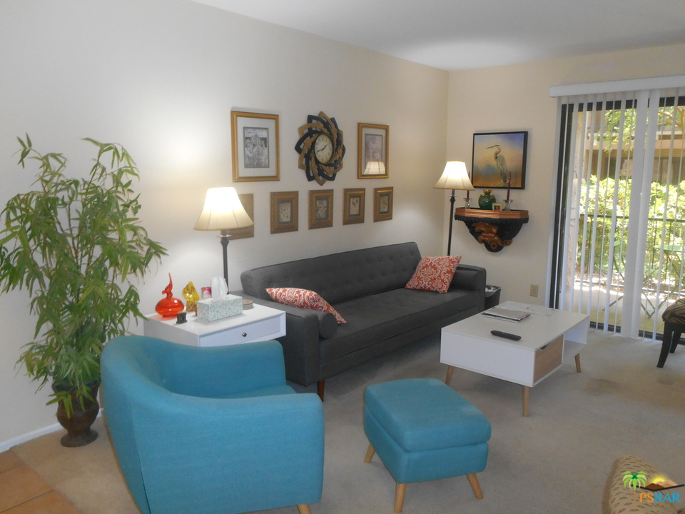 1050 Ramon Road, Unit 20 Palm Springs, CA 92264 - Photo 1 of 35 a living room with furniture and a large window