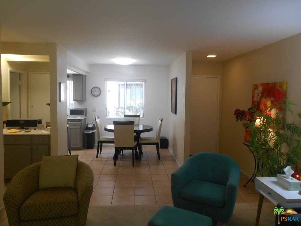 1050 Ramon Road, Unit 20 Palm Springs, CA 92264 - Photo 12 of 35 a living room with furniture and a potted plant