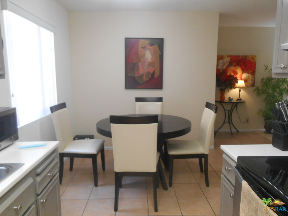 1050 Ramon Road, Unit 20 Palm Springs, CA 92264 - Photo 13 of 35 a view of a workspace with furniture and a window