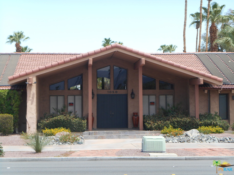 1050 Ramon Road, Unit 20 Palm Springs, CA 92264 - Photo 34 of 35 a view of a house with a yard and potted plants