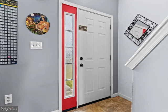 a view of a hallway with front door