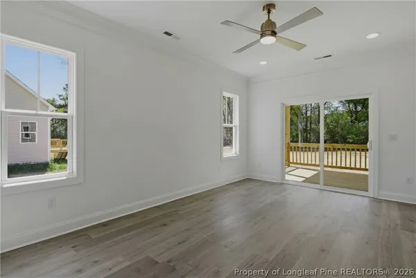 a bathroom with a granite countertop toilet sink and mirror
