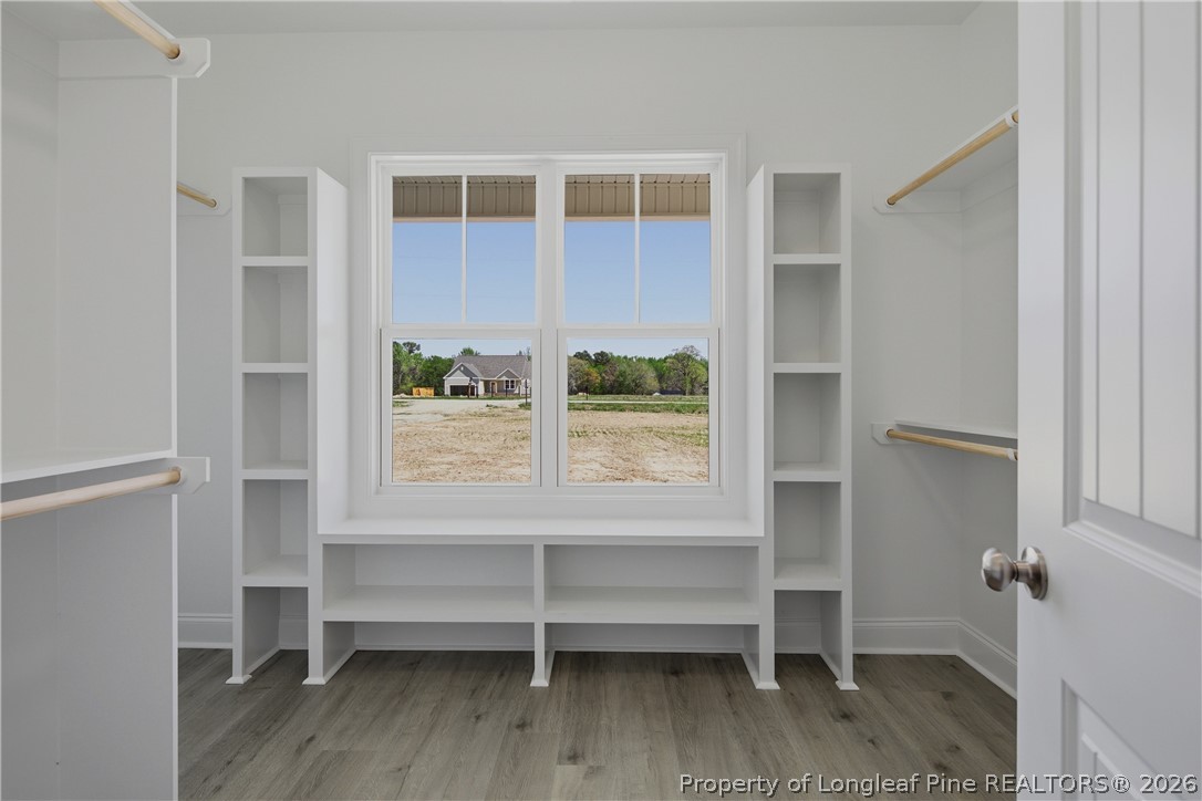 3223 Leaflet Church Road Broadway, NC 27505 - Photo 17 of 30 a view of room with window and wooden floor