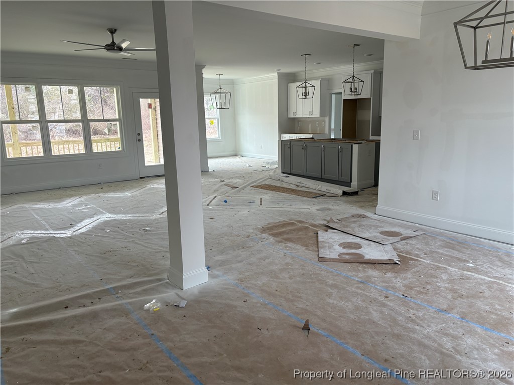 3223 Leaflet Church Road Broadway, NC 27505 - Photo 2 of 18 a room with a washing machine and flat screen tv
