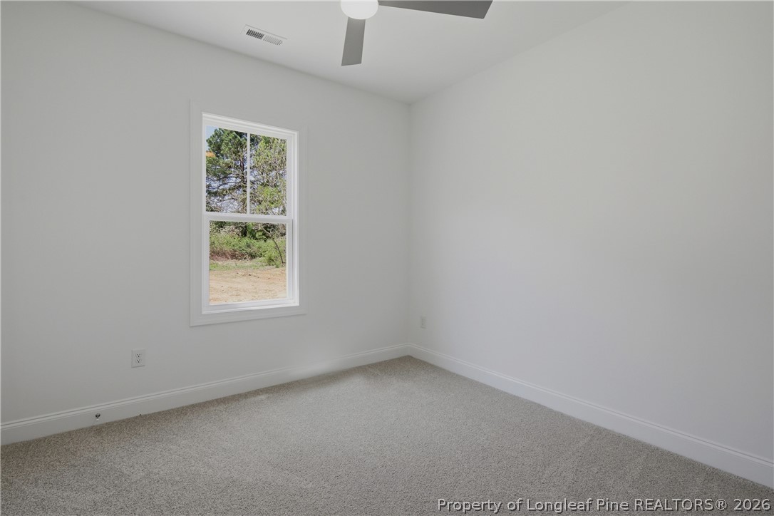 3223 Leaflet Church Road Broadway, NC 27505 - Photo 21 of 30 an empty room with a window