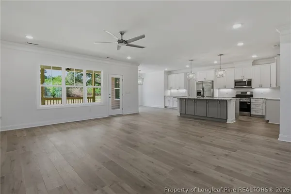 a view of kitchen with wooden floor and window
