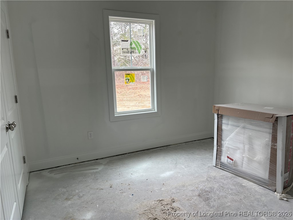3223 Leaflet Church Road Broadway, NC 27505 - Photo 8 of 18 a view of an empty room with a window