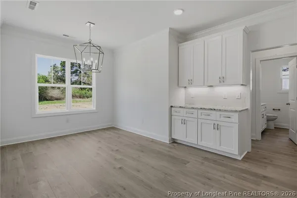 a kitchen with window wooden floor and floors