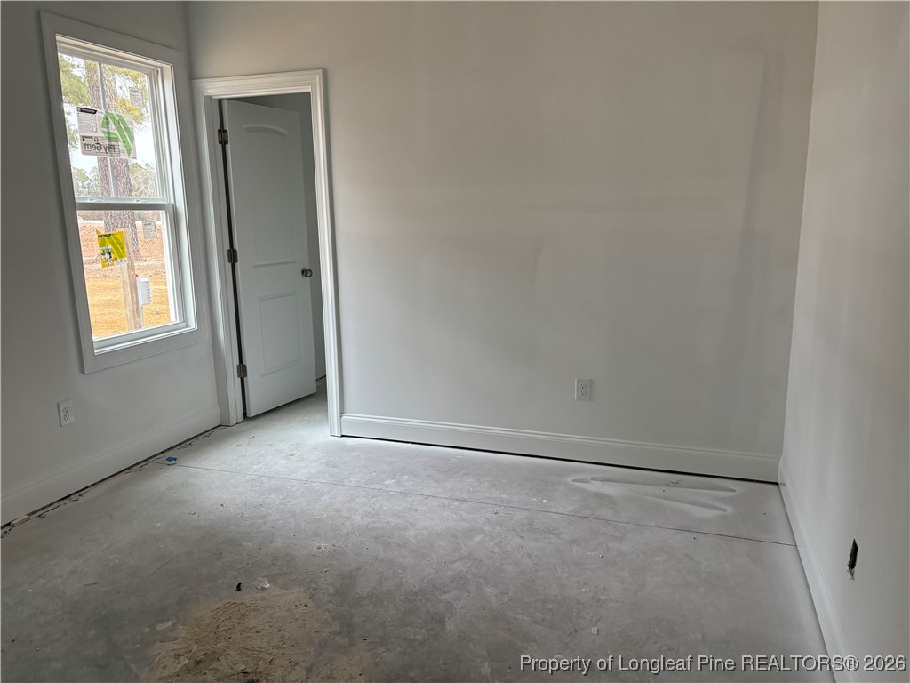 3223 Leaflet Church Road Broadway, NC 27505 - Photo 10 of 18 an empty room with windows and closet