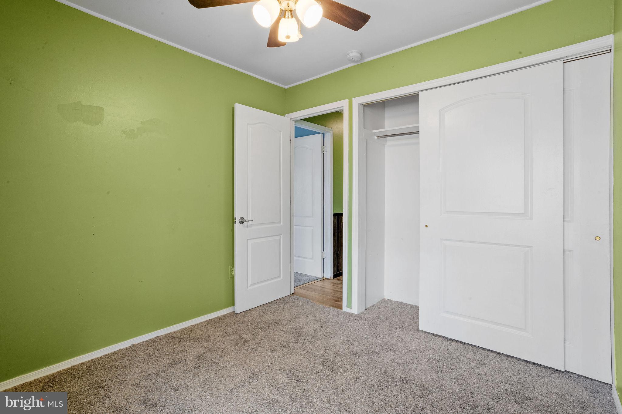 47 Farmbrook Drive Levittown, PA 19055 - Photo 11 of 28 an empty room with a ceiling fan and a window