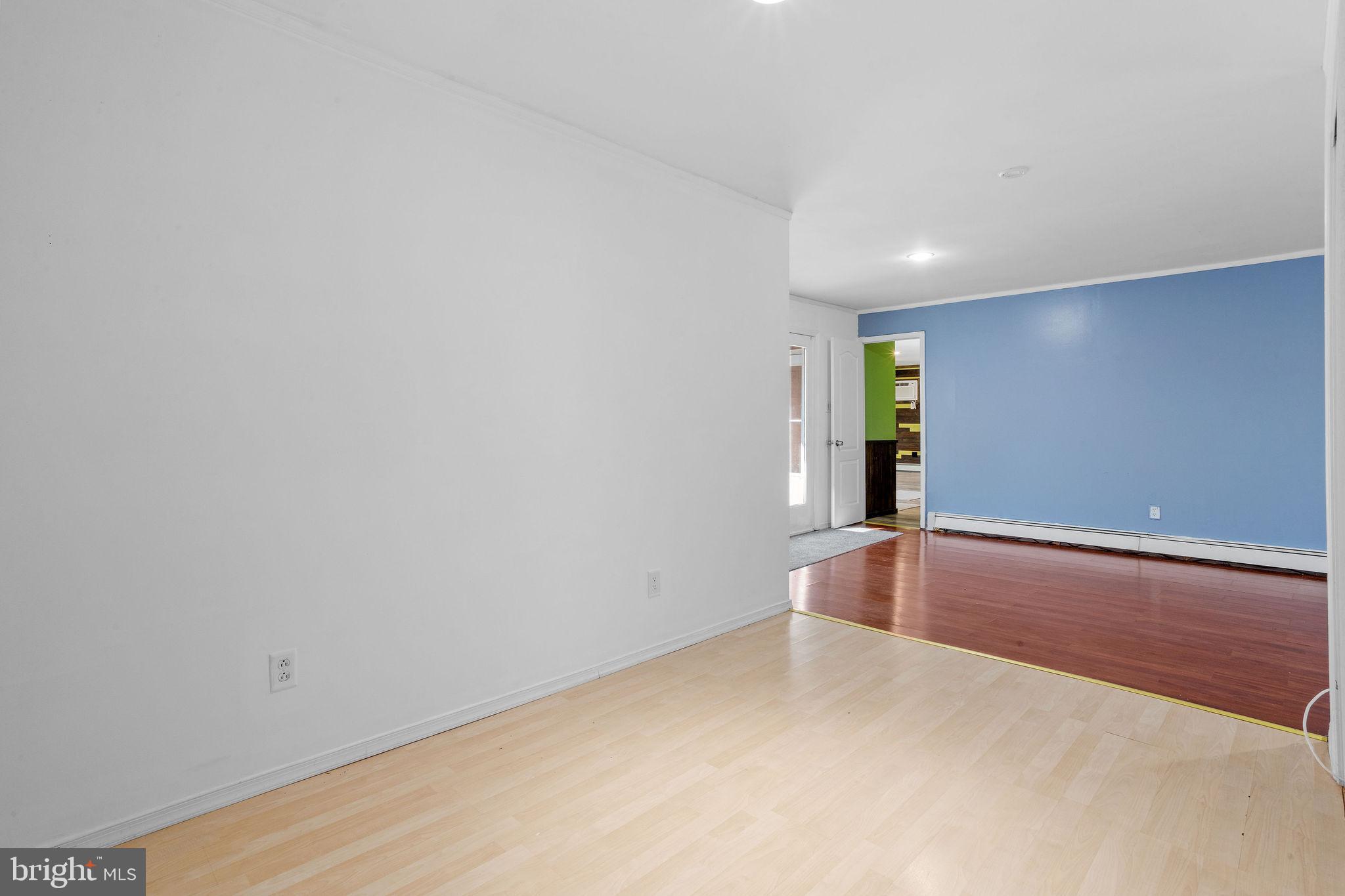 47 Farmbrook Drive Levittown, PA 19055 - Photo 17 of 28 a view of an empty room with wooden floor