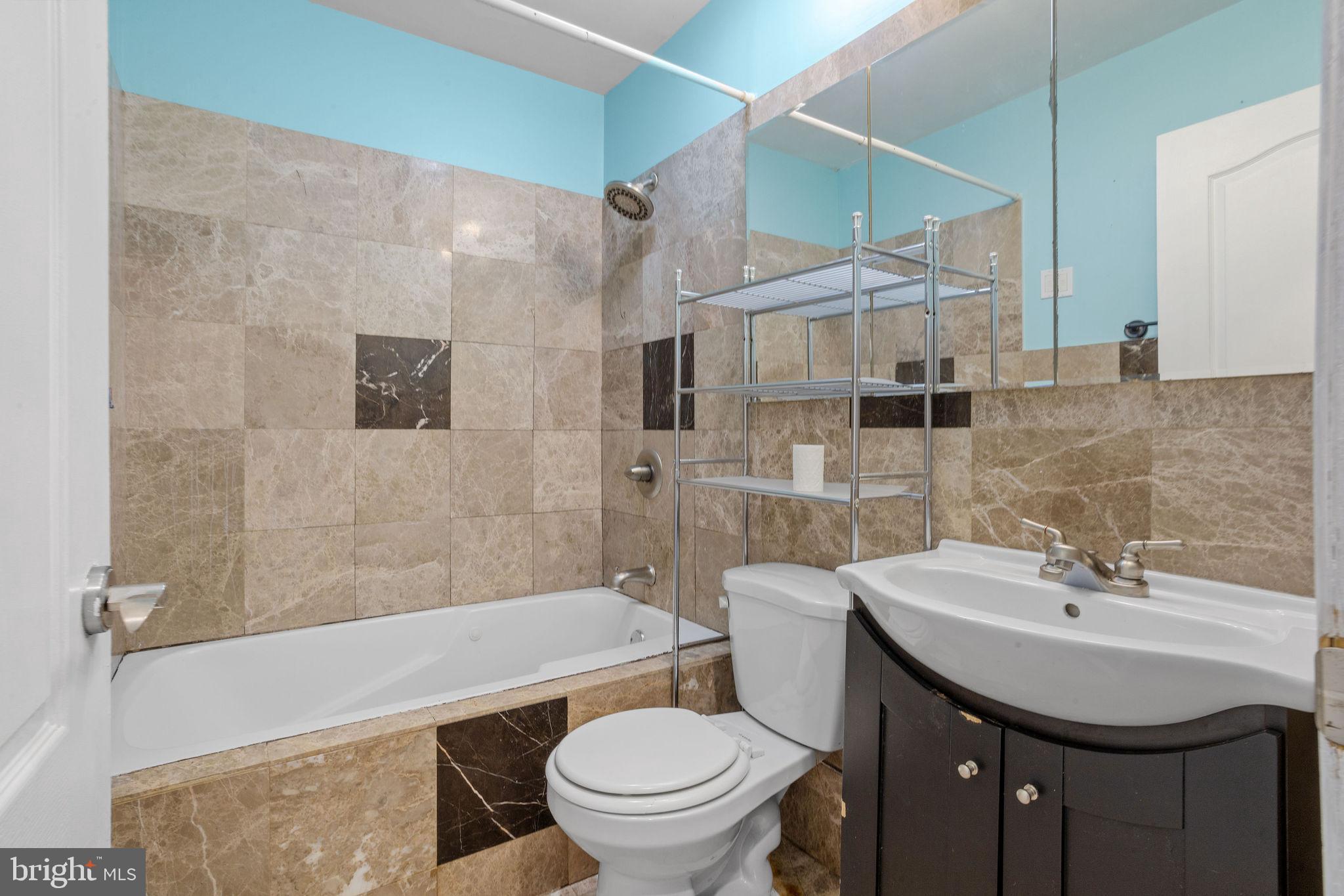 47 Farmbrook Drive Levittown, PA 19055 - Photo 20 of 28 a bathroom with a sink toilet and shower